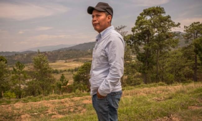 Patricio López stands in front of the land where the Marlin mine operated